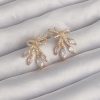 Bouquet Boutique Pirinç Gold Renk Zirkon Taşlı Fiyonk Küpe