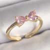 Bouquet Boutique Pirinç Gold Renk Pembe Zirkon Taşlı Kalp Fiyonk Model Kadın Yüzük