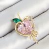 Bouquet Boutique Pembe Ve Yeşil Zirkon Taşlı 3D Eriyen Kalp Figürlü Gold Renk Kadın