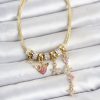 Bouquet Bouqtique Pirinç Gold Renk Kalp ve Çiçek Detaylı Charmlı Kadın Bileklik BQT35BB8460