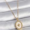 Bouquet Bouqtique 316L Çelik Gold Renk Zincir Beyaz Mineli Kutup Yıldız İşlemeli Madalyon Model Kadın Kolye BQT35BKO10063