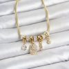 Bouquet Bouqtique Pirinç Gold Renk Çiçek Detaylı Charmlı Kadın Bileklik BQT35BB8452