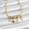 Bouquet Bouqtique Pirinç Gold Renk Göz Detaylı Charmlı Kadın Bileklik BQT35BB8458