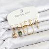 Bouquet Bouqtique 316L Çelik Gold Renk Zirkon Taşlı Zincir ve Kutup Yıldız Detaylı Kadın Küpe Seti BQT35BKP11880