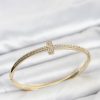 Bouquet Bouqtique Gold Renk T Model Zirkon Taşlı Kadın Kelepçe Bileklik BQT35BB8621