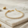 Bouquet Bouqtique Pirinç Gold Renk İnce Zirkon Taşlı Su Yolu Kadın Bileklik BQT35BB8893